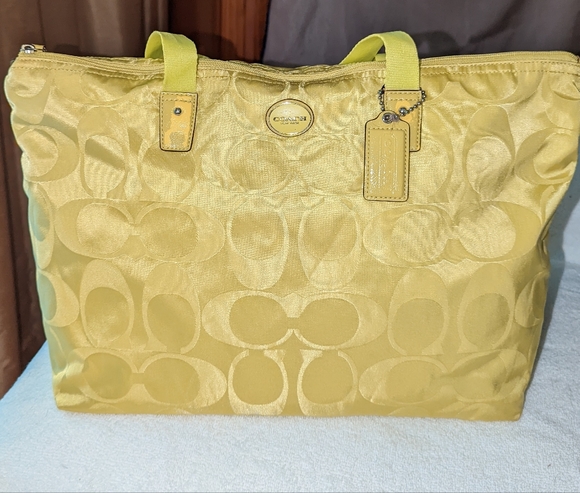 Coach Handbags - Coach signature nylon weekender bag in citrine.